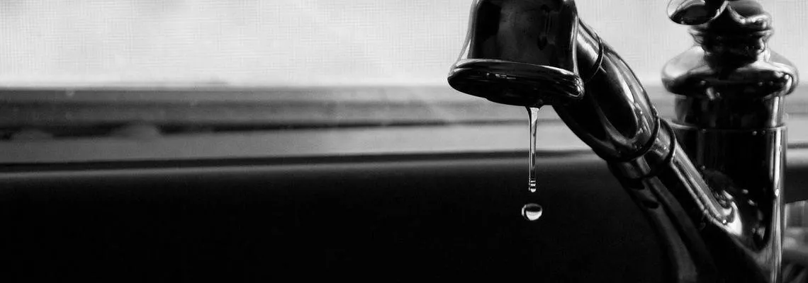 A photo of a dripping faucet.