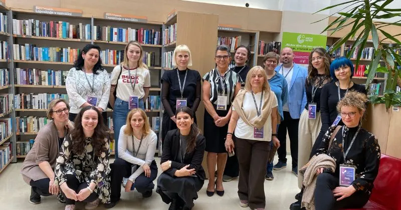 Group of people posing at the Ljubljana City Library.