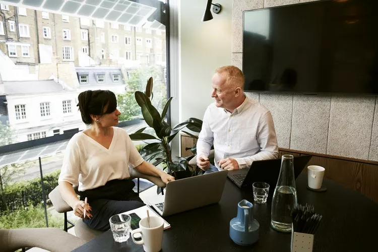 Man-and-woman-discussing-and-sharing-ideas-2977565