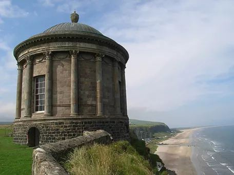 Scenic photo o fbuilding on the coast of Northern Ireland.