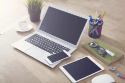 Tablet, computer and iphone on a desk Tablet, computer and iphone on a desk.